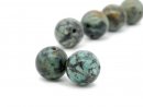 Two pierced green turquoise beads