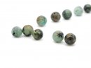 Five pierced turquoise beads