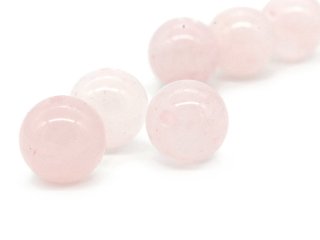 Three pierced rose quartz balls