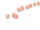 Three pierced pink opal spheres