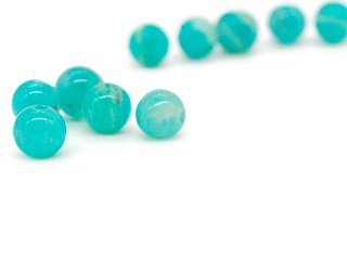 Five green amazonite beads