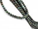 Dark pierced turquoise beads