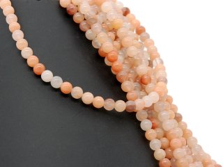 Orange-coloured, pierced calcite