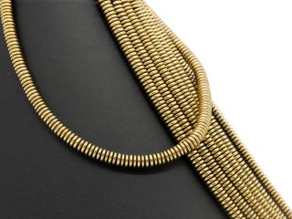 Pierced, sparkling, golden haematite lenses