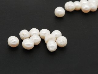 Ten white cultured pearls