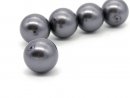 A pierced, dark grey shell core pearl