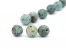 Three pierced turquoise beads