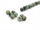 Eight pierced turquoise beads