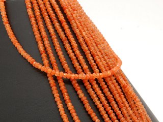 Orange coloured agates in faceted rondel shape
