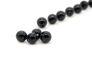 Four black pierced tourmaline beads