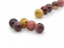 Five colourful, pierced jasper beads