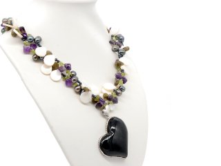 Necklace made of pearls and gemstones with a large onyx heart