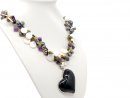Necklace made of pearls and gemstones with a large onyx...
