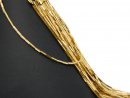 Pierced, gold-coloured, rectangular haematite rods
