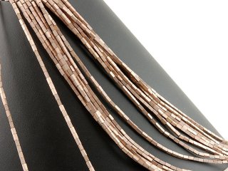 Pierced, rectangular haematite rollers in brown