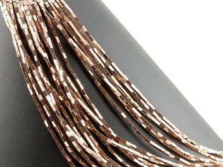 Pierced, rectangular haematite rollers in brown