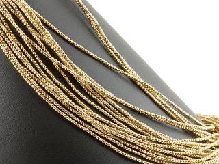 Pierced, sparkling, golden haematite spheres
