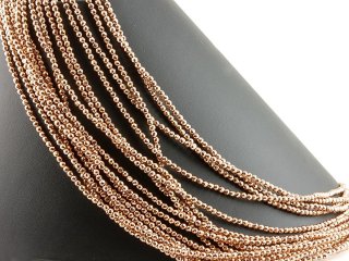 Pierced, rose gold, faceted haematite spheres