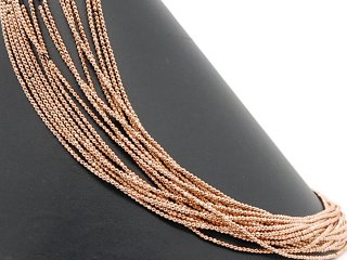 Pierced, rose gold haematite spheres