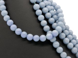 Grandes boules dangélite percées en bleu