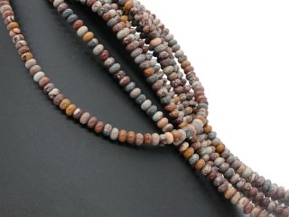 Patterned, pierced rondels made of jasper in shades of brown and grey