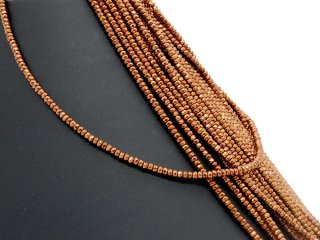 Pierced, faceted, small haematite rondelle in brown