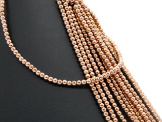 Pierced, rose gold haematite spheres