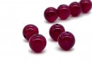Four pierced agate beads in magenta