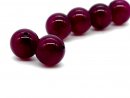 Two pierced agate beads in magenta