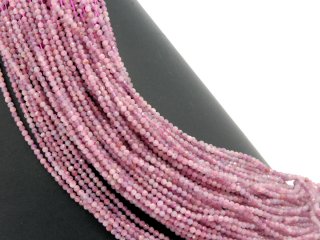 Faceted, pierced tourmaline beads in a muted lilac-pink colour