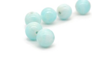 two light blue pierced gemstone beads
