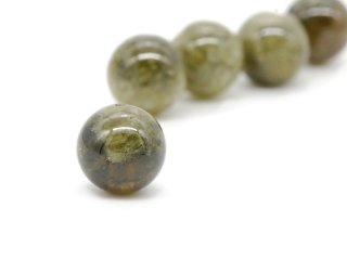 Pierced green garnet ball