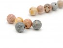 Five pierced coloured jasper beads
