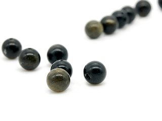 Six pierced, shimmering obsidian balls