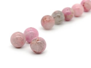 Three pierced rhodonites in grey and pink