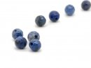 Four faceted, pierced gemstone beads