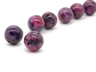 Two purple jasper beads