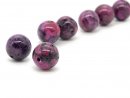 Two purple jasper beads