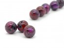 Three colourful, pierced jasper beads