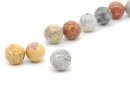 Three pierced coloured jasper beads