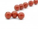 Three red pierced jasper beads