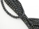 Pierced, dark grey labradorite spheres