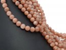 Pierced, pinkish-brown moonstone beads
