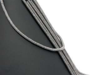 Pierced, frosted lenses made of grey hematite