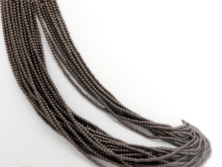 Pierced, small haematite beads in brown