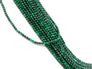Faceted, pierced, green malachite spheres