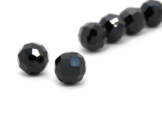 Two faceted, pierced spinels