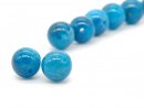 Two blue pierced apatite beads