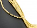 Pierced, sparkling, golden haematite spheres