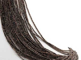 Pierced, faceted, small haematite rondelle in brown